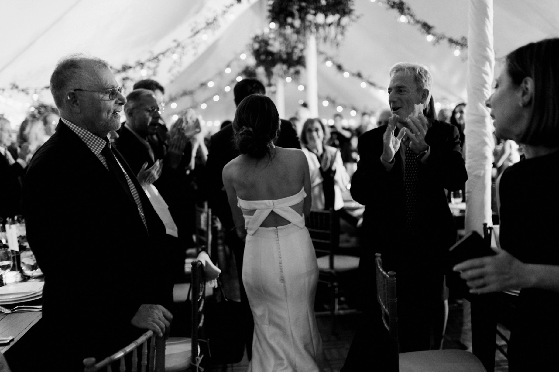 bride and groom enter the reception space