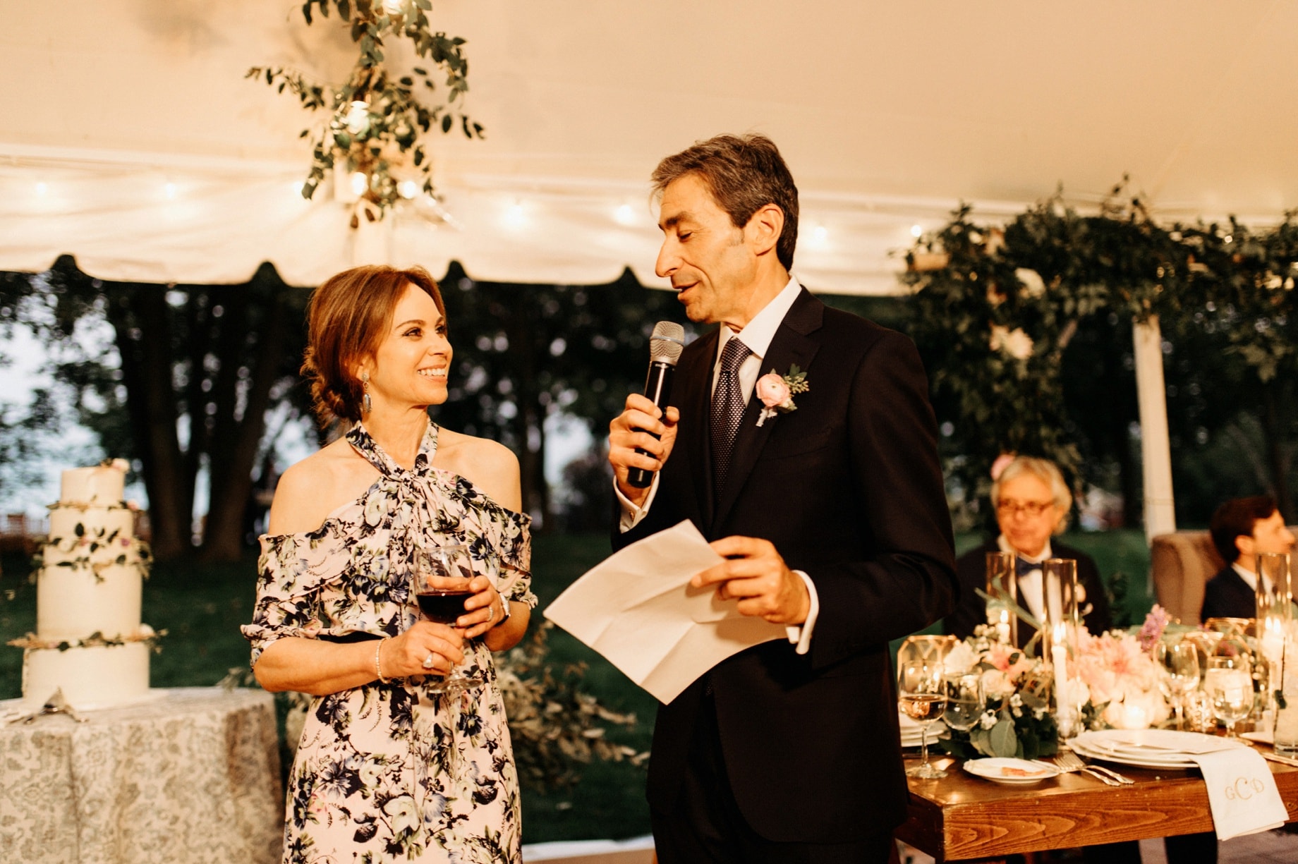 father of the bride gives a toast to his daughter at her cornman farms wedding