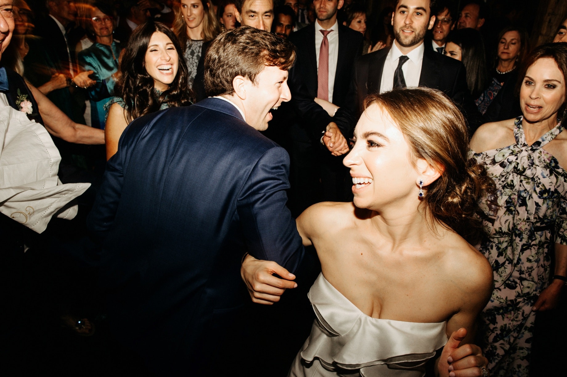 bride and groom dancing with guests