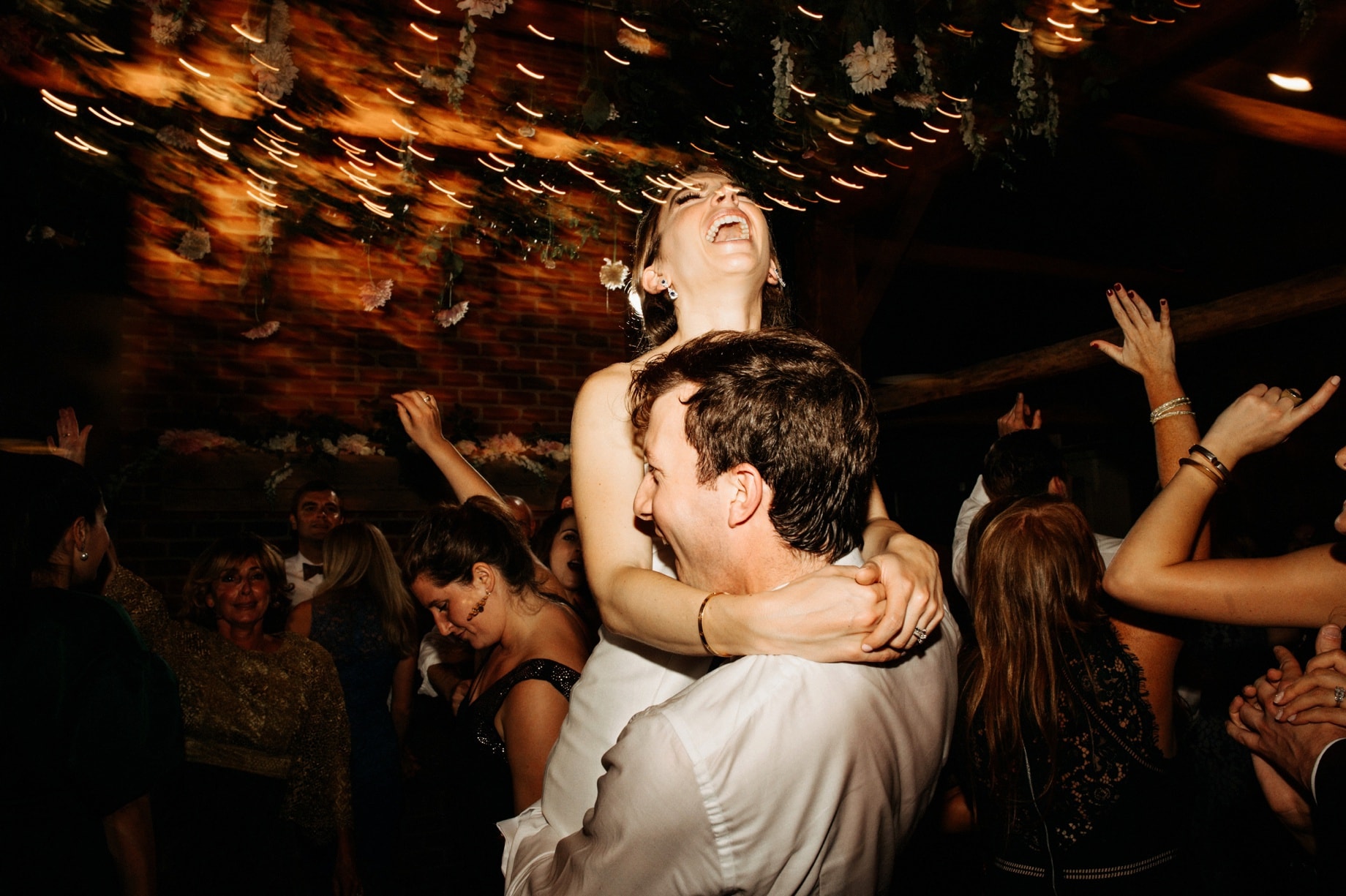 groom lifts and spins bride