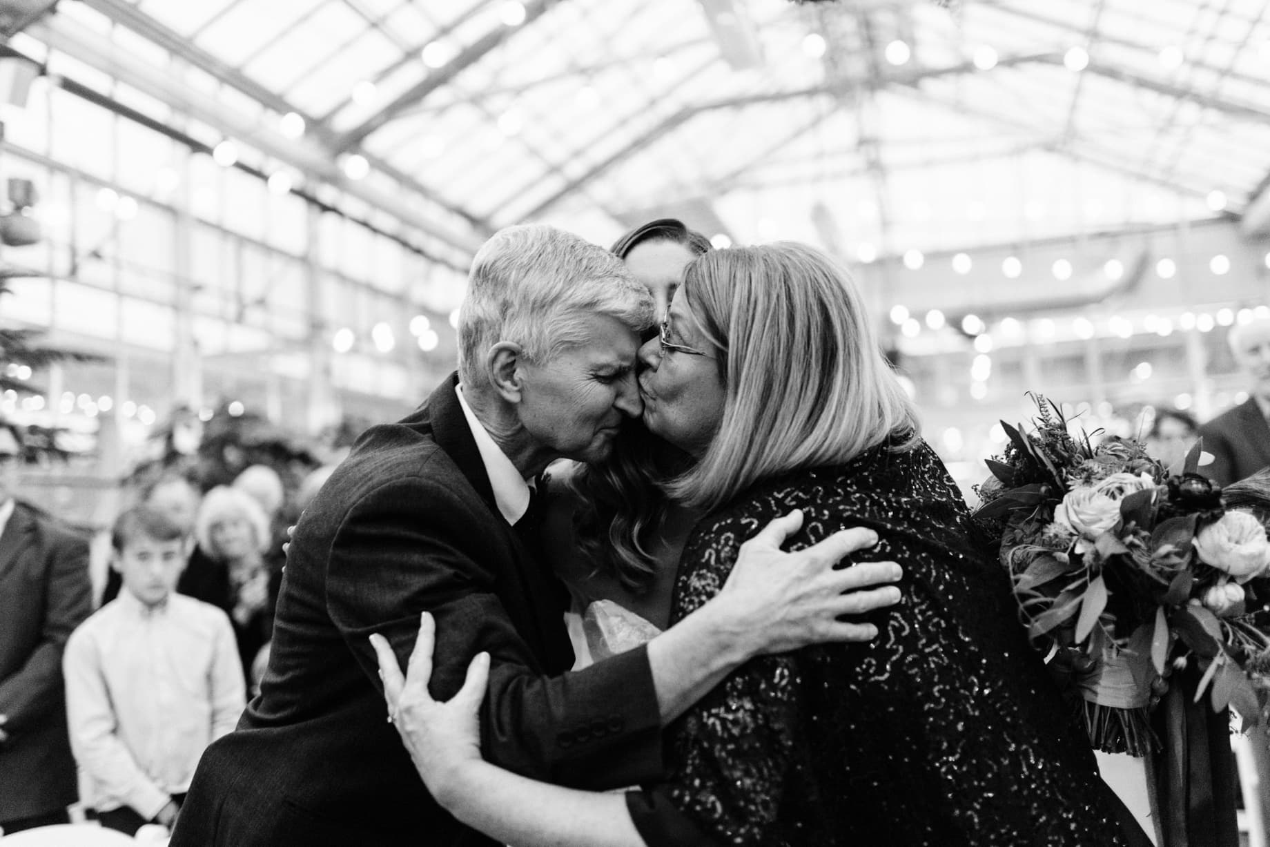 parents giving away their daughter on her wedding day in Grand Rapids