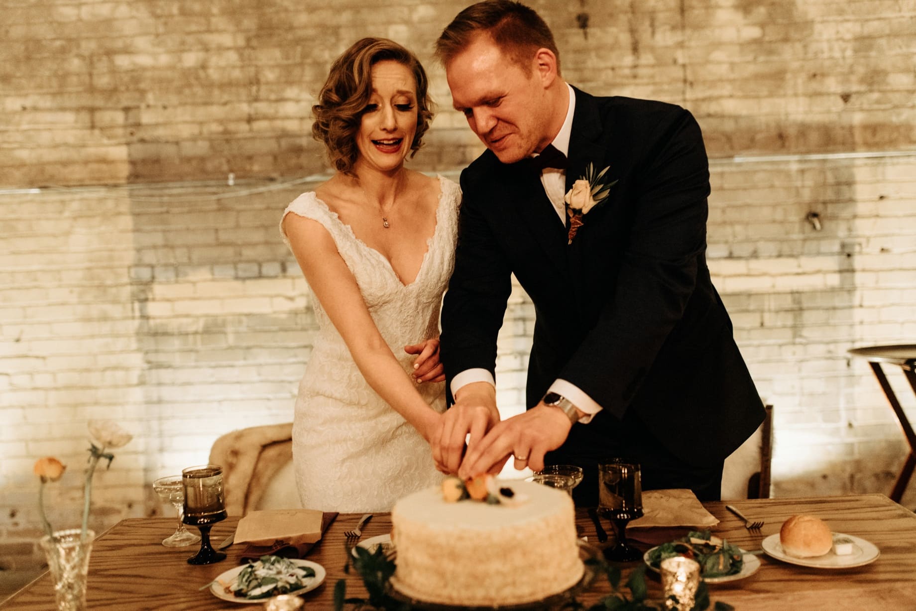 couple cutting the cake at the jam handy