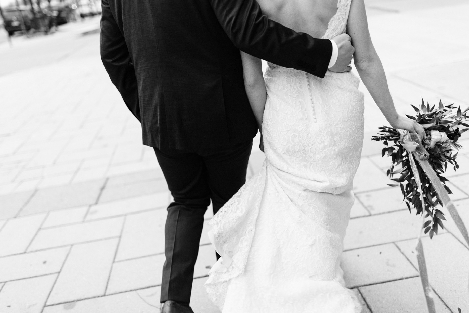 bride and groom walking in detroit