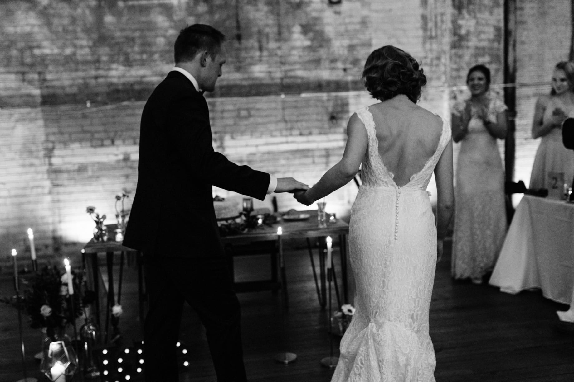 bride and groom entering their wedding reception at the Jam Handy