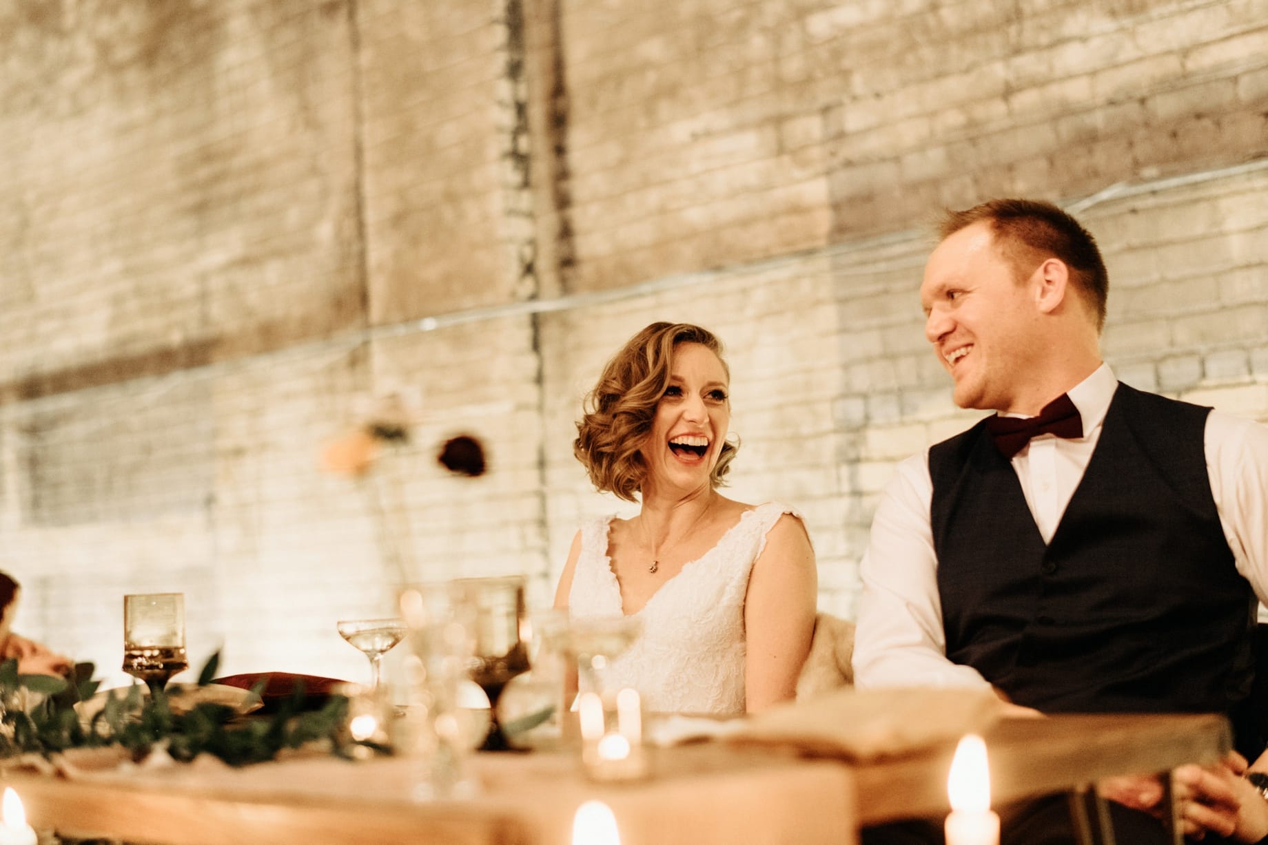 bride and groom reacting to speeches