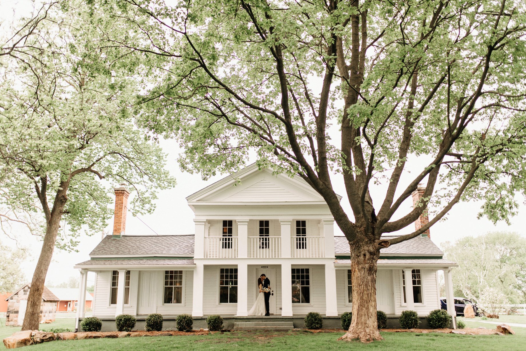 couple on the front porch of cornman farms