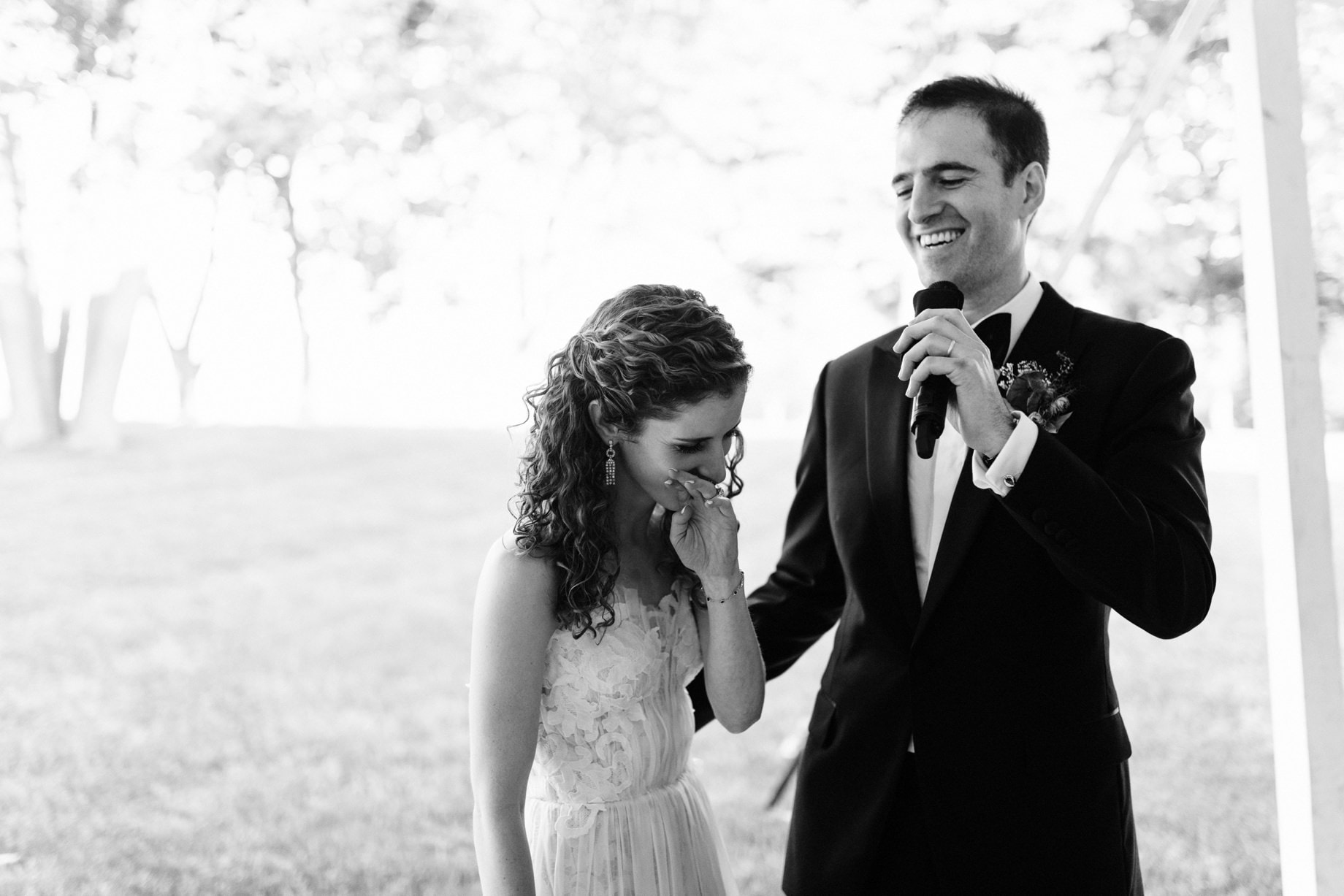 groom giving a toast to his wife