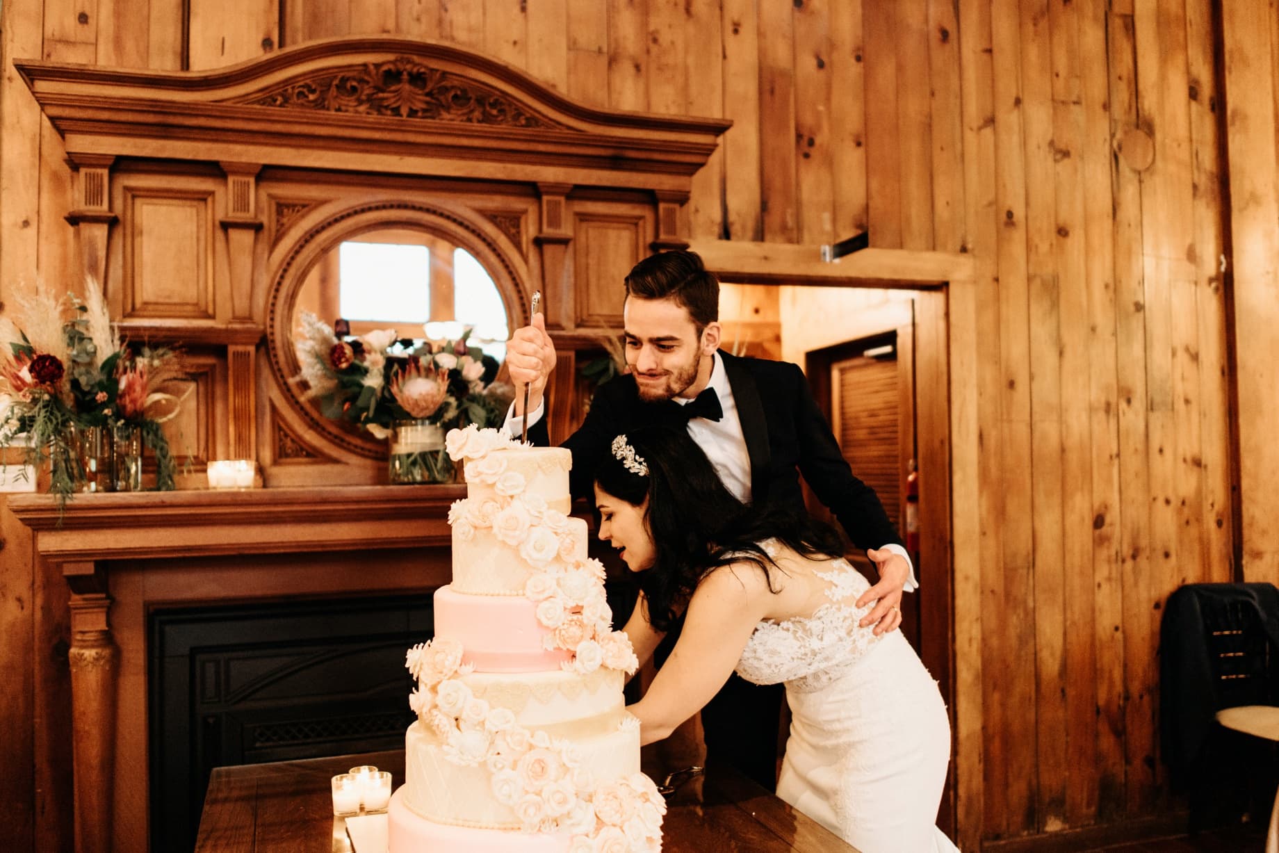 bride and groom cutting cake