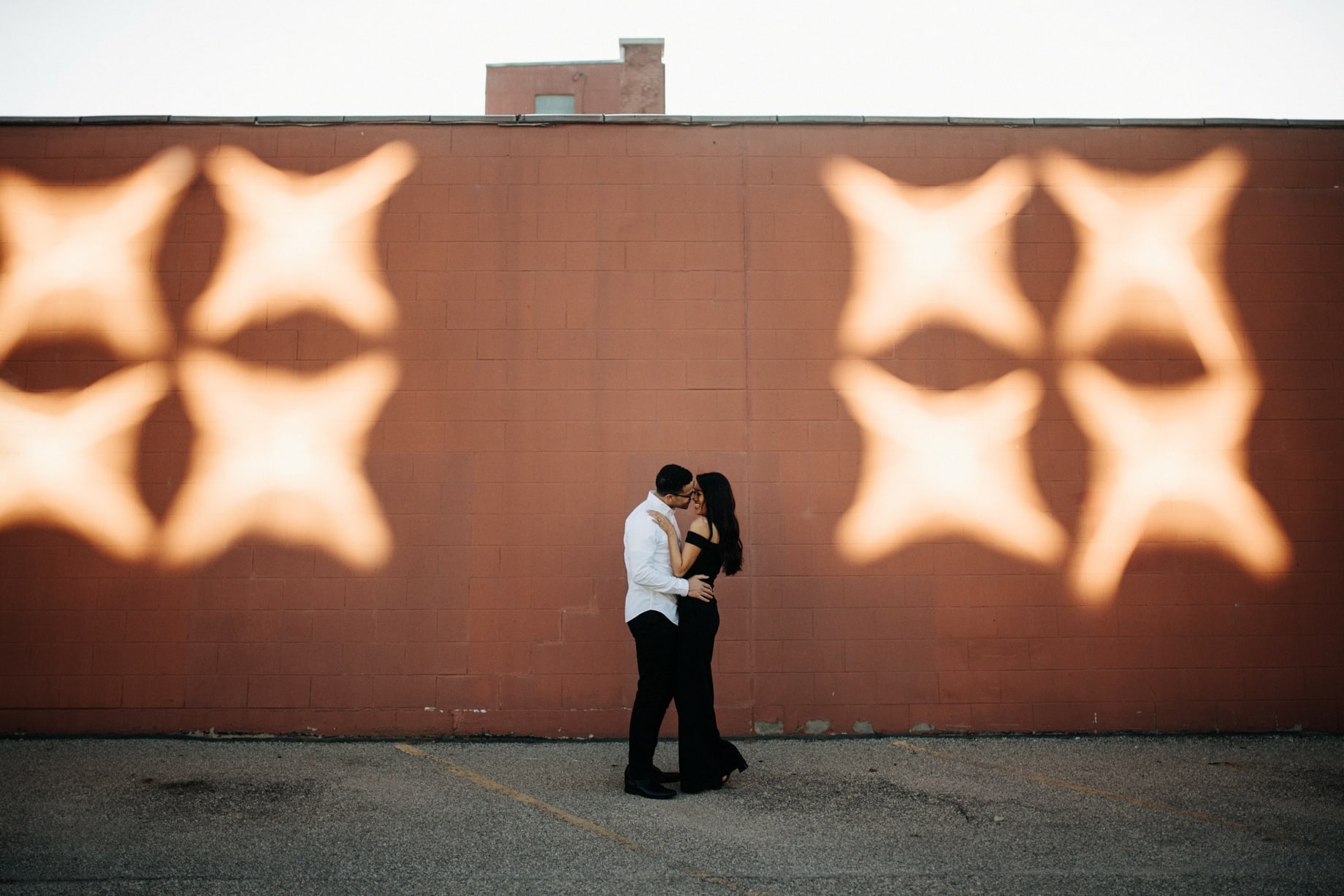 a stylish couple poses for portraits in grand rapids