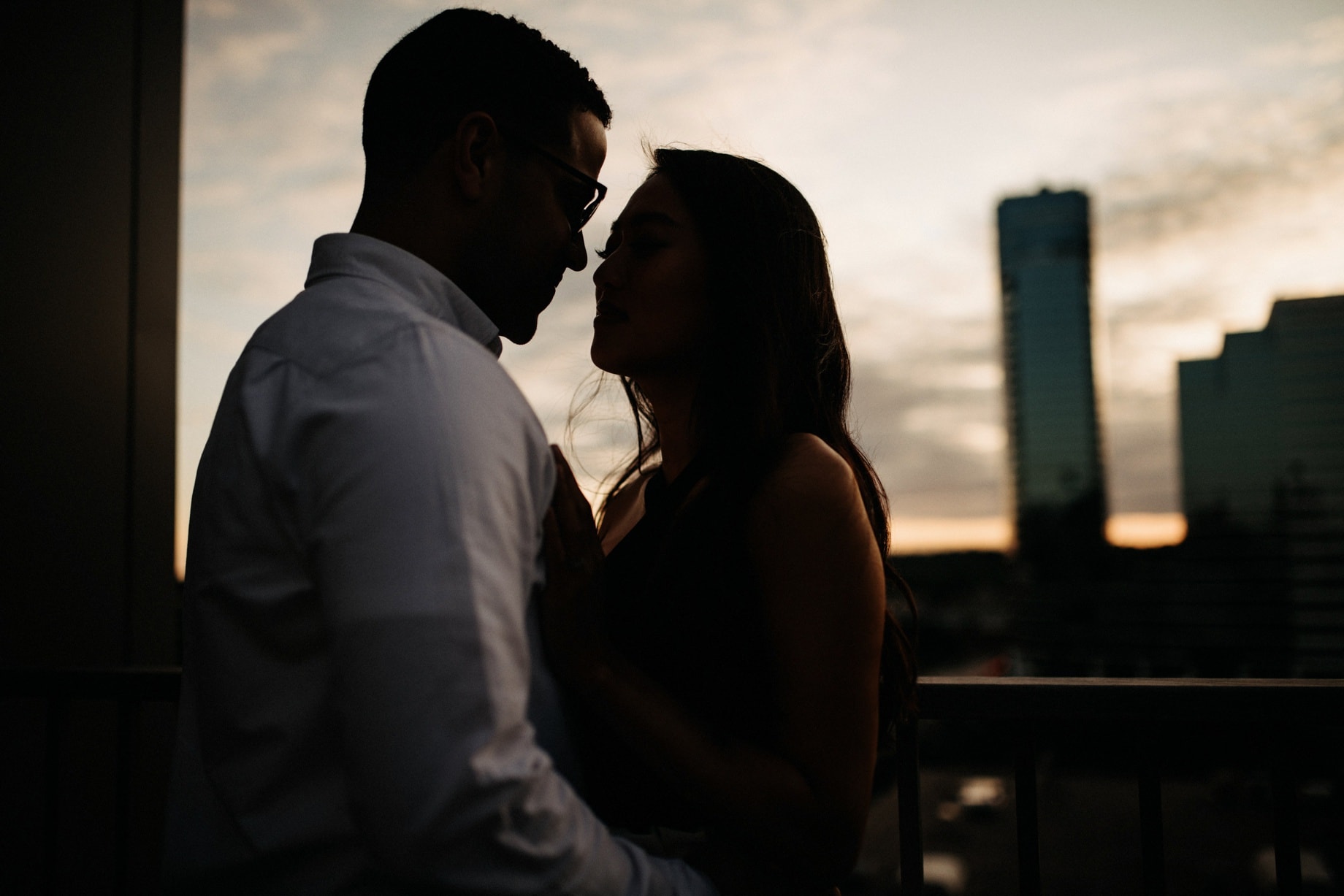 engagement photos on a rooftop in grand rapids at sunset
