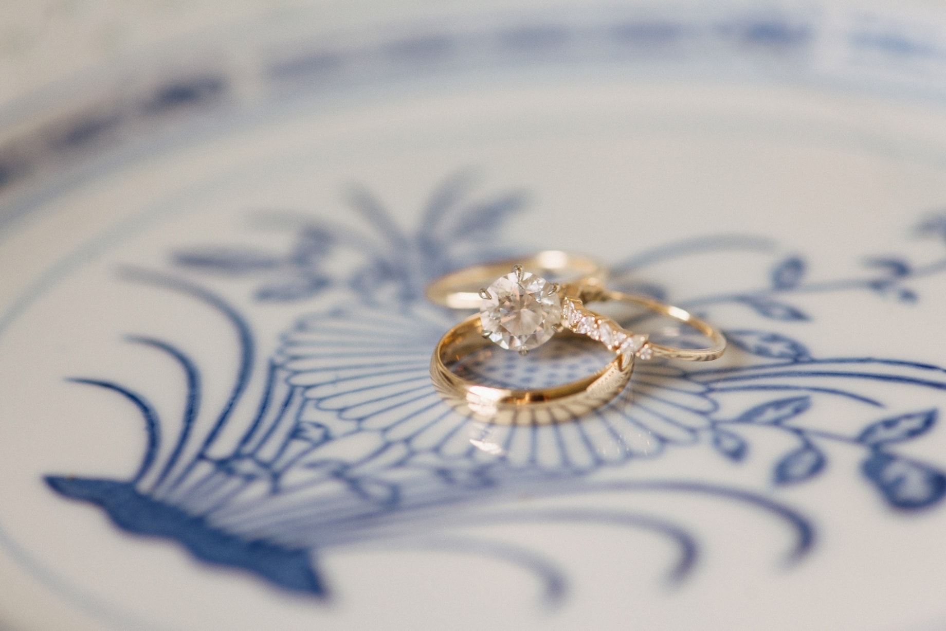 a detail shot of rings on a blue and white plate