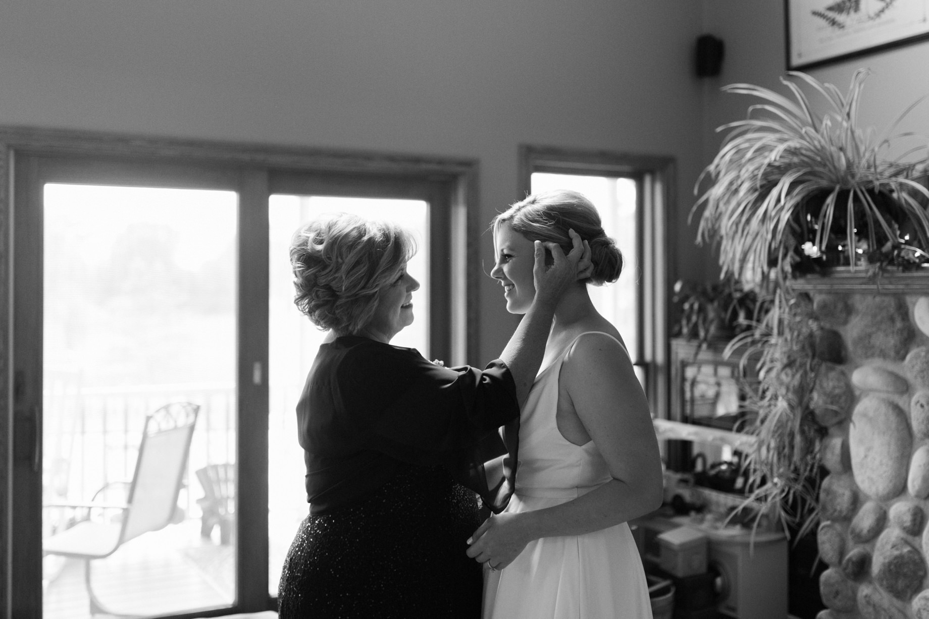 a mother takes a moment to admire her daughter on her wedding day