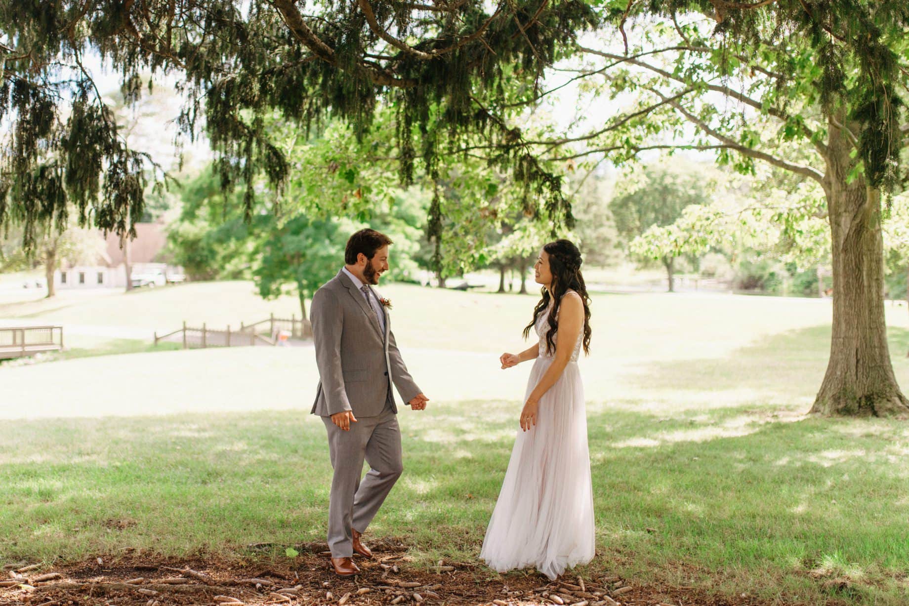 groom seeing his bride in her dress for the first time