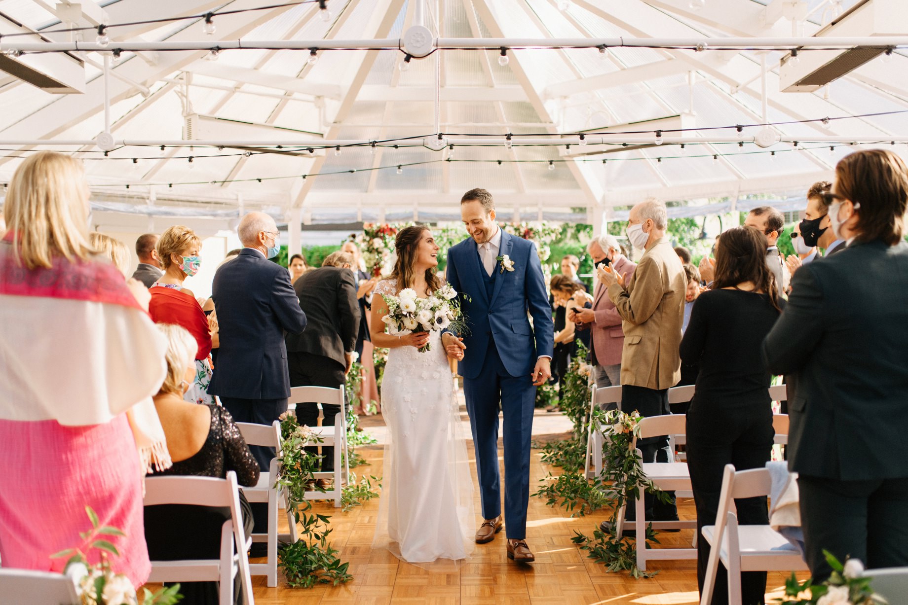 couple walking back down the aisle after their wedding ceremony at the perry hotel in petoskey michigan