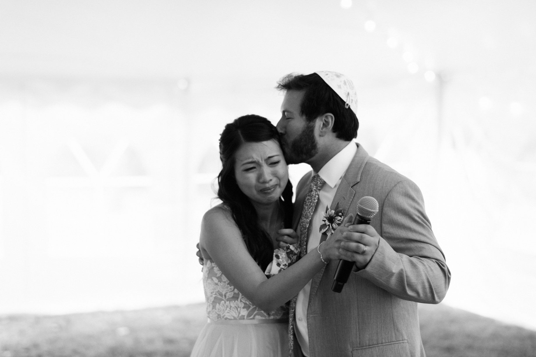 bride and groom share an emotional speech with their wedding guests