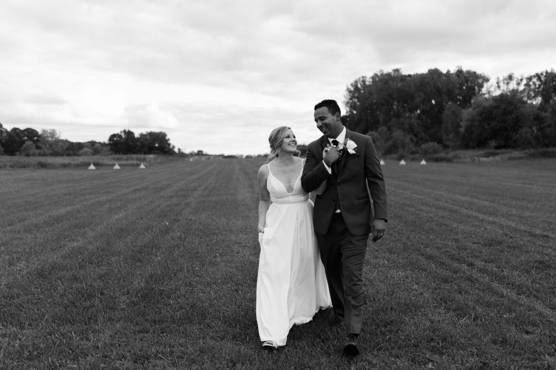 couple strolling on a rural runway