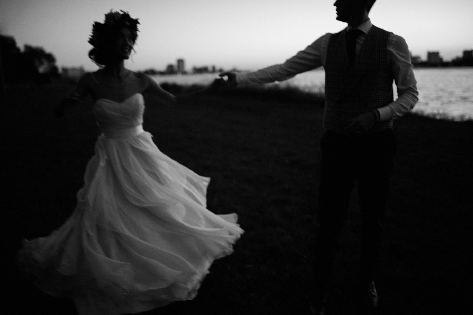 artistic black and white portrait of a bride and groom on belle isle by photojournalistic Detroit wedding photographer Heather Jowett