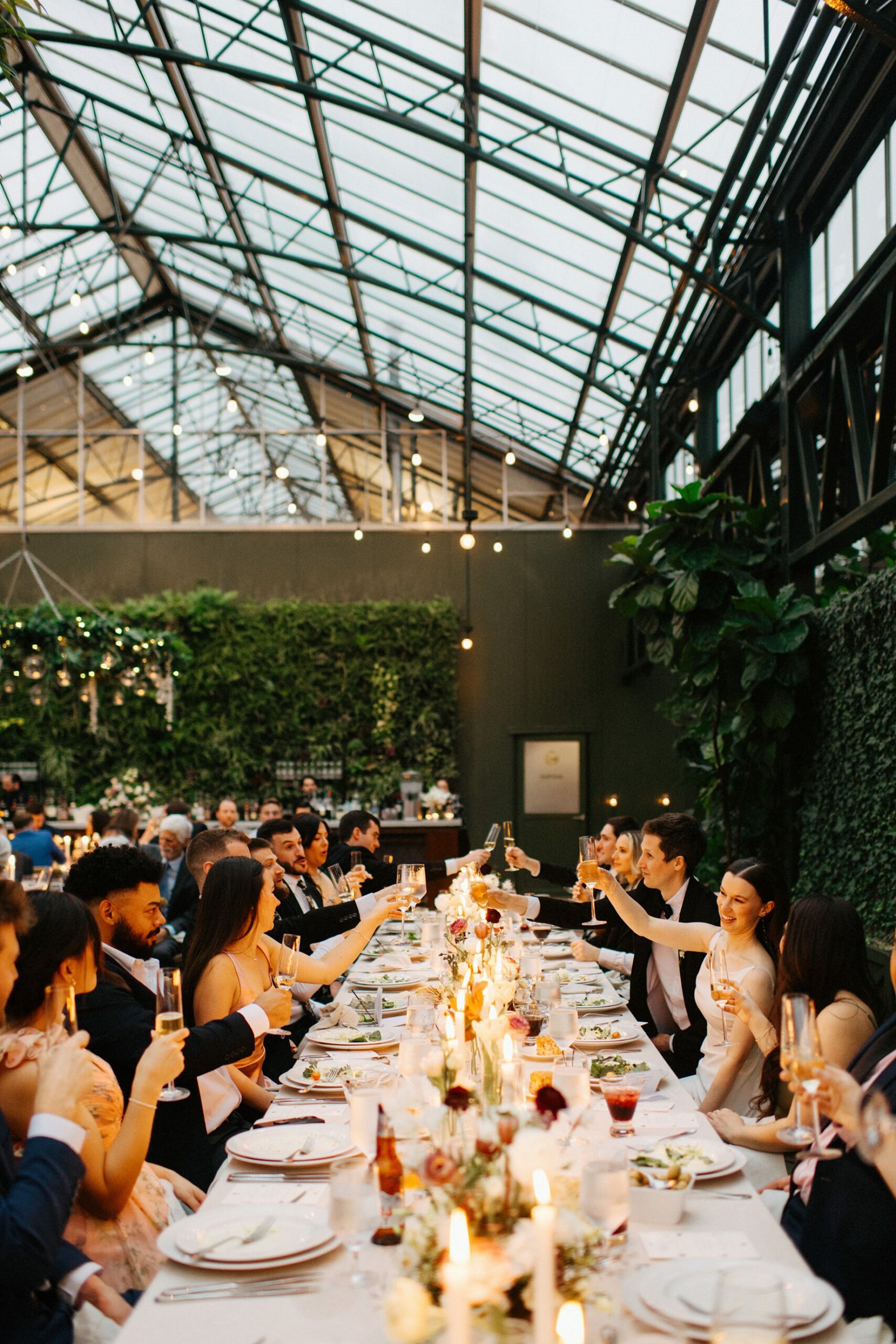 bride and groom toasting at their Planterra Conservatory Wedding by wedding photographer Heather Jowett 2