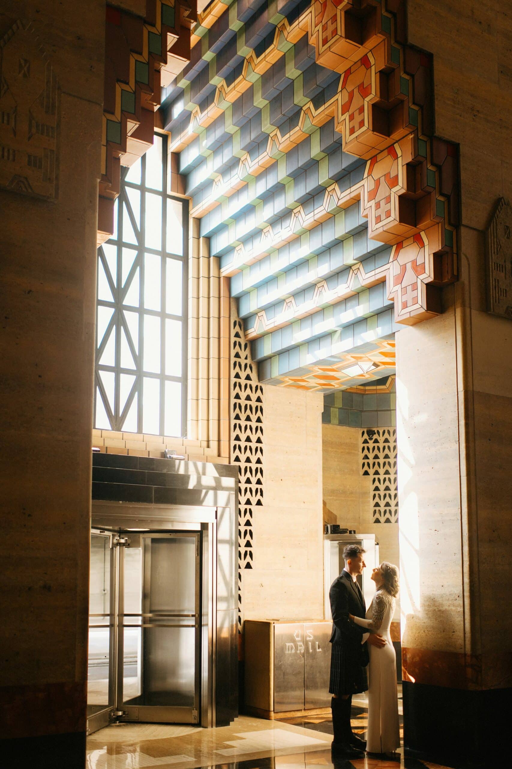 a portrait of a bride and groom during their guardian building wedding