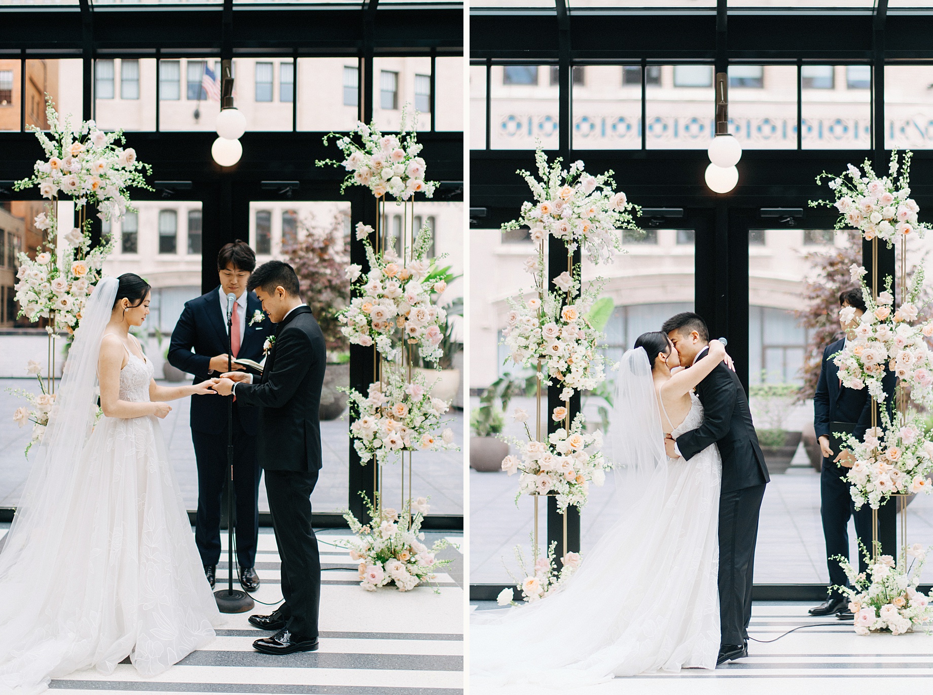 Bride and groom exhchanging rings and a first kiss in front of a lush floral backdrop