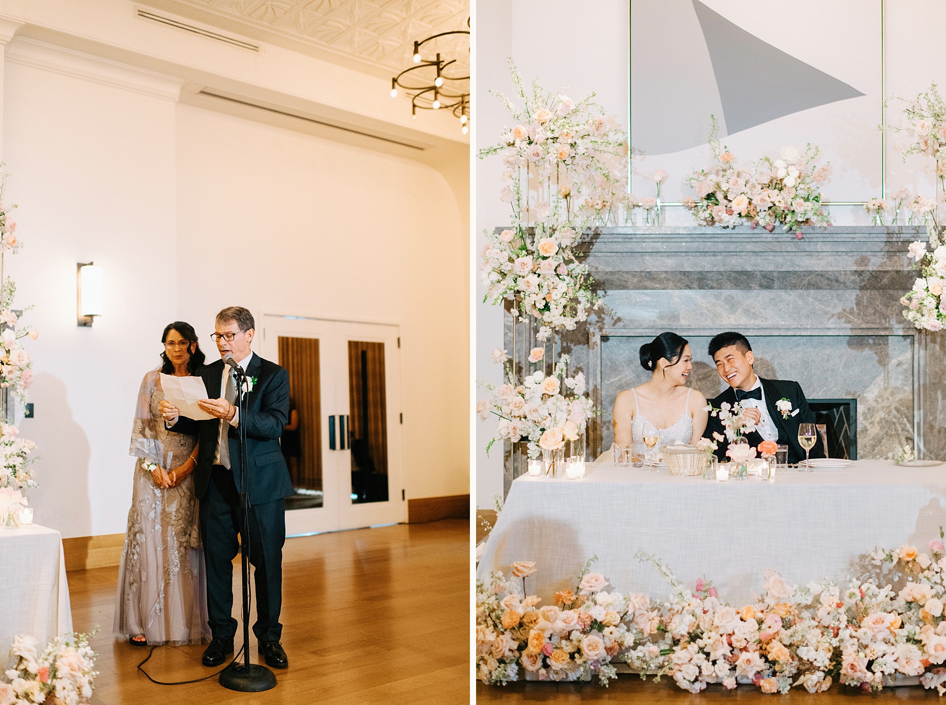 Bride and groom smile joyfully at their sweetheart table adorned with soft blush and ivory florals in front of a grand fireplace at the Shinola Hotel wedding reception
