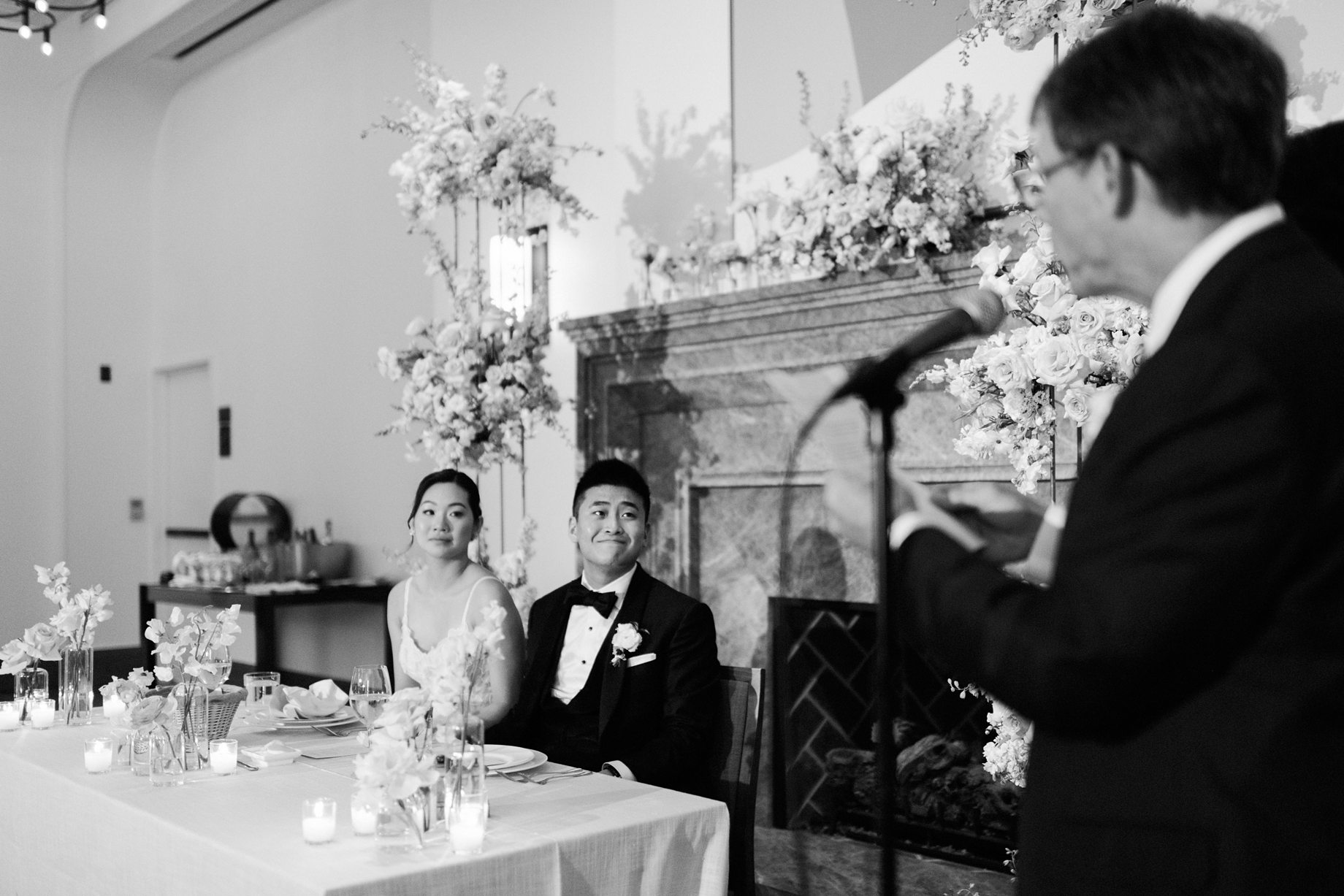 Father of the bride gives a heartfelt toast beside the mother of the bride during the reception at the Shinola Hotel as the newlyweds look on with emotion