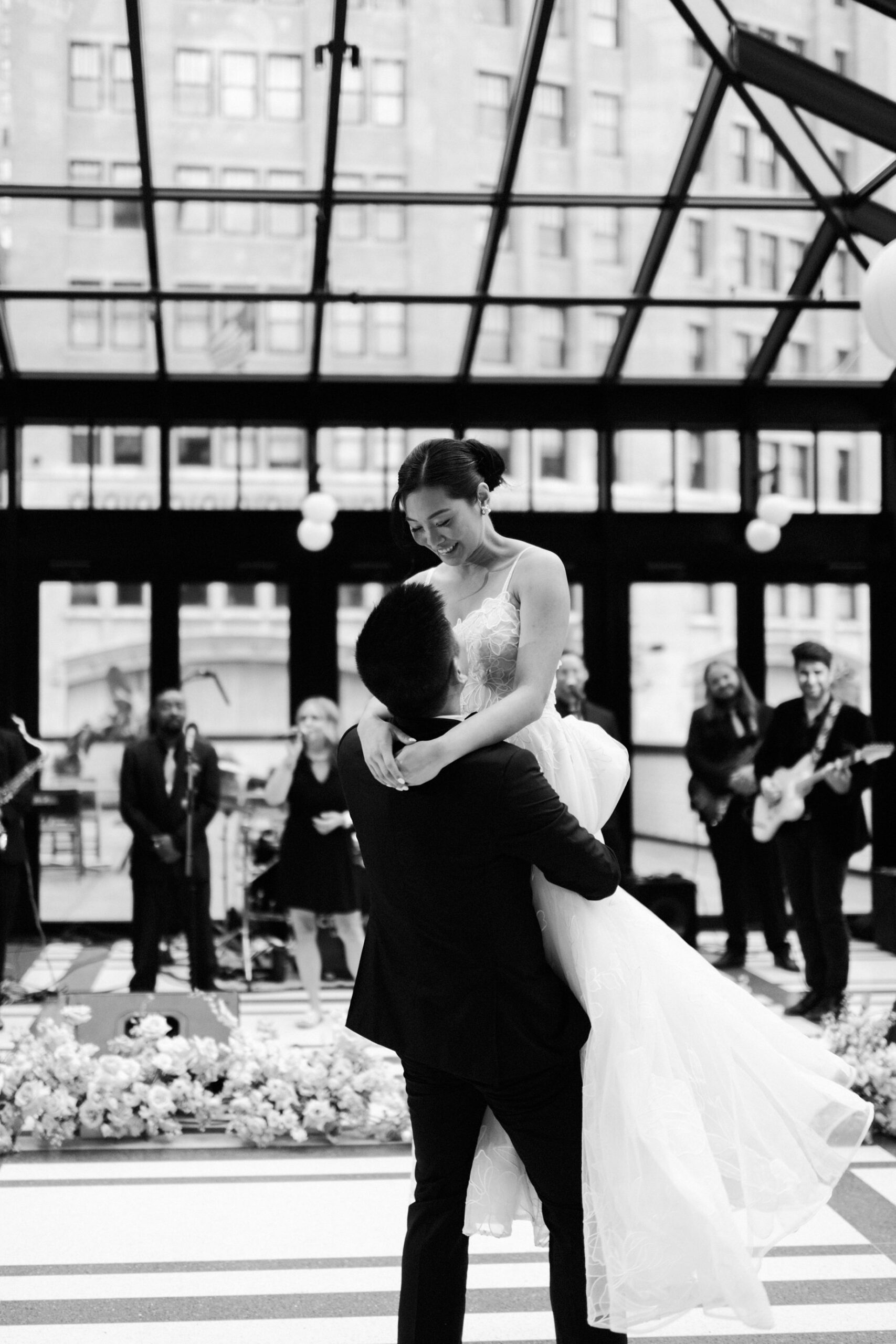 Groom lifts the bridey during their first dance