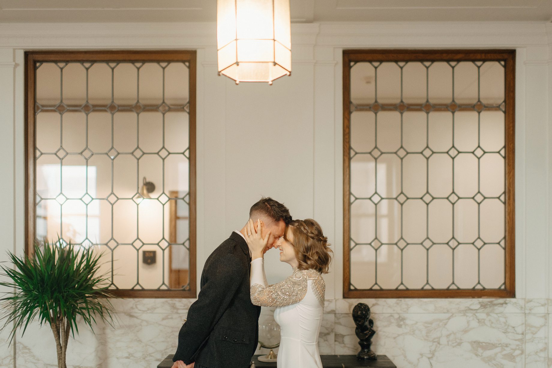 A romantic first look moment between the couple at the detroit foundation hotel