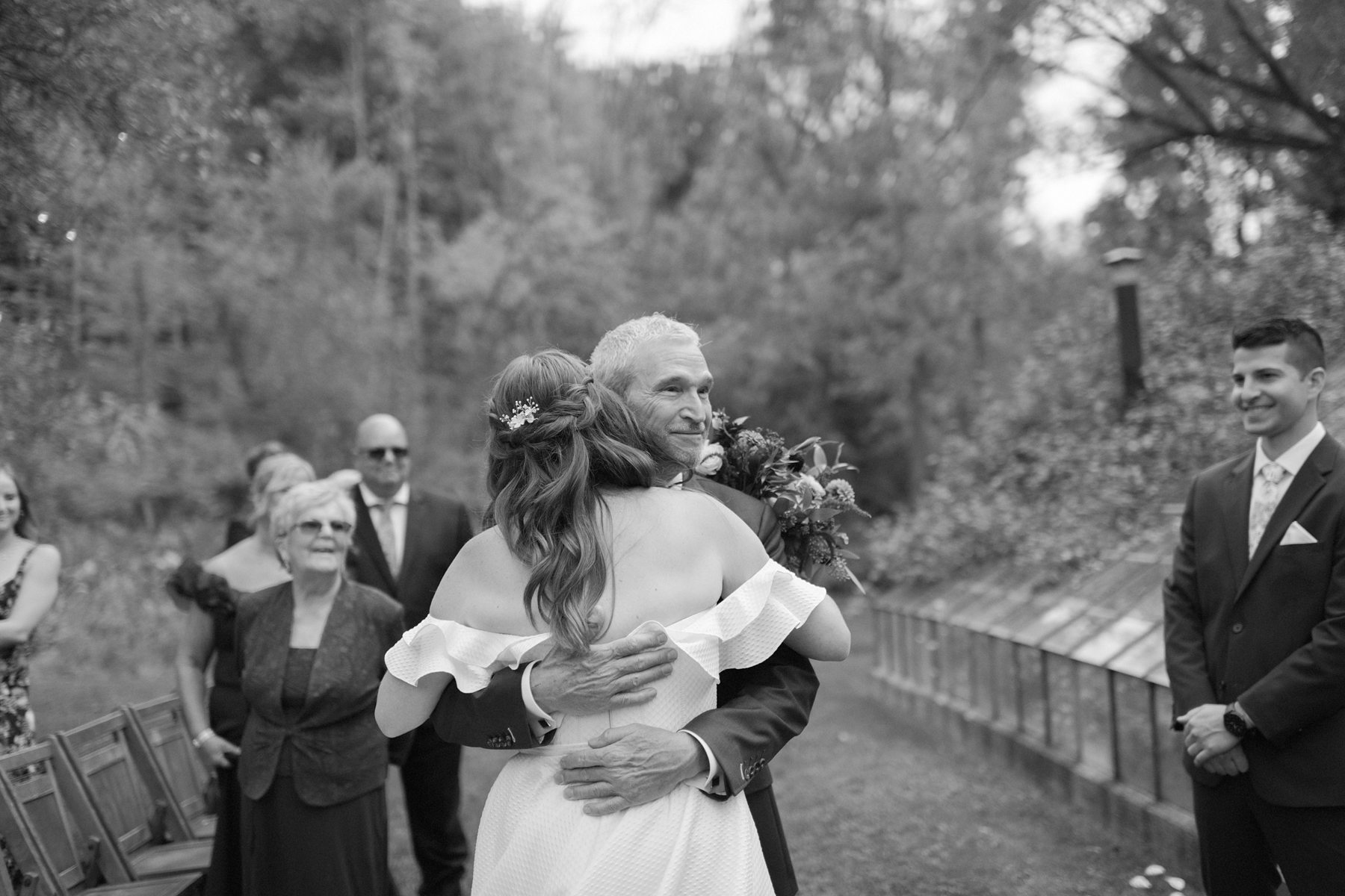 Bride hugs her dad after he gives her away