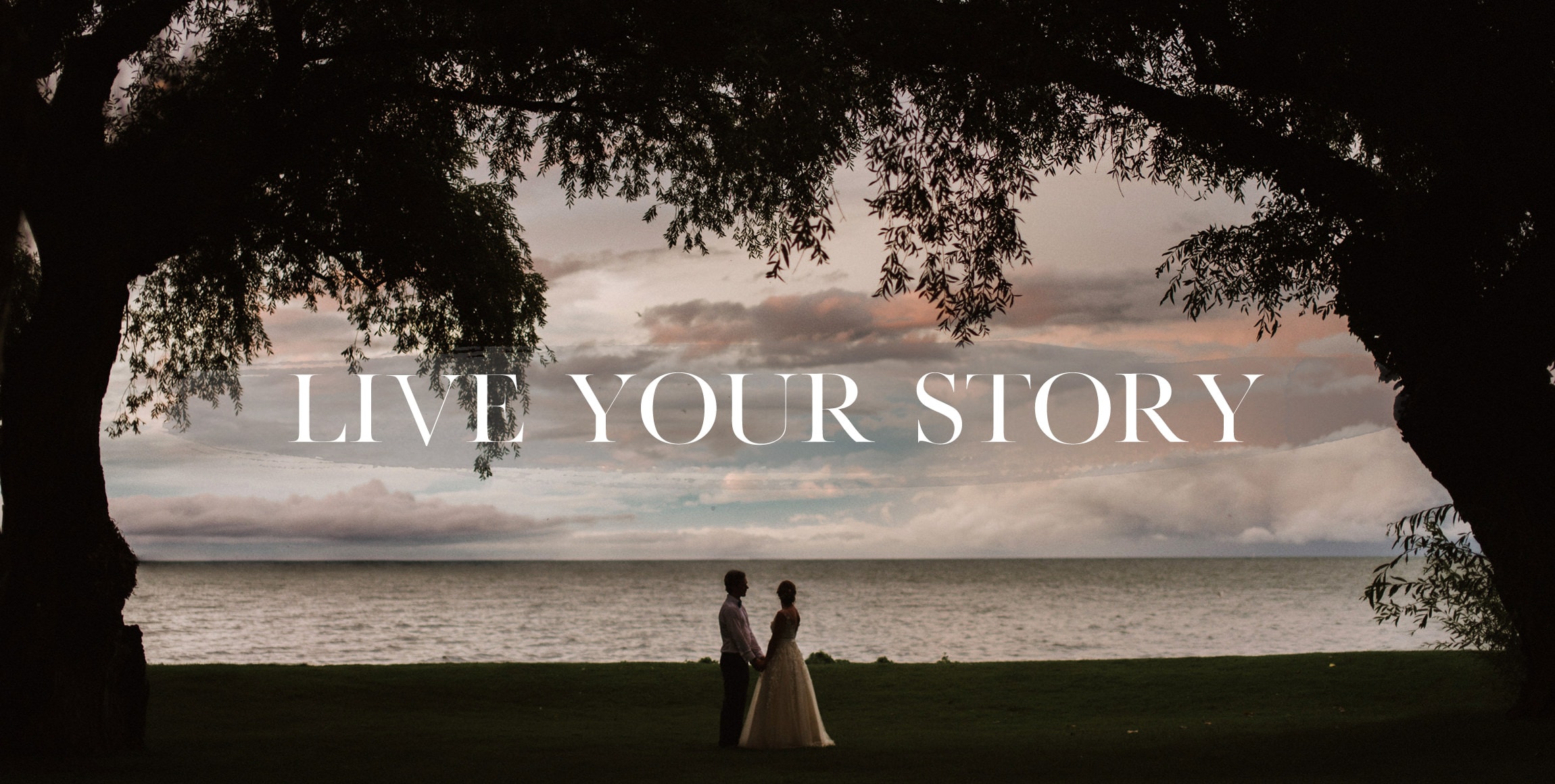 a couple poses by Lake Saint Clair at the Edsel Ford House Wedding