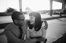 couple laughing during their engagement session in eastern market detroit