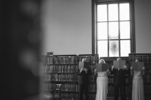A wedding party poses for portraits inside the Detroit public library.