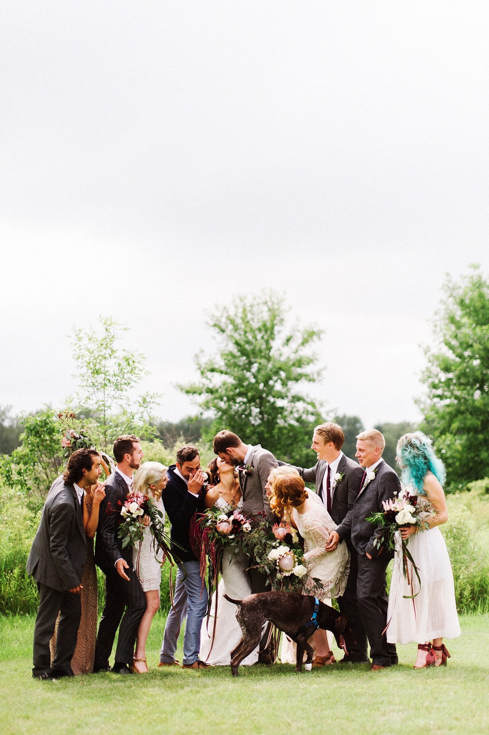 wedding party posing with dog