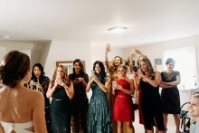 bridemaids reacting to seeing bride in her dress