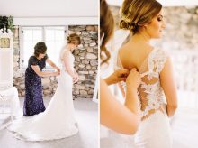 mother helps bride into dress