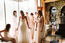 bridesmaids reacting to seeing bride in her wedding dress
