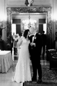 bride and groom posing with champagne at the detroit athletic club