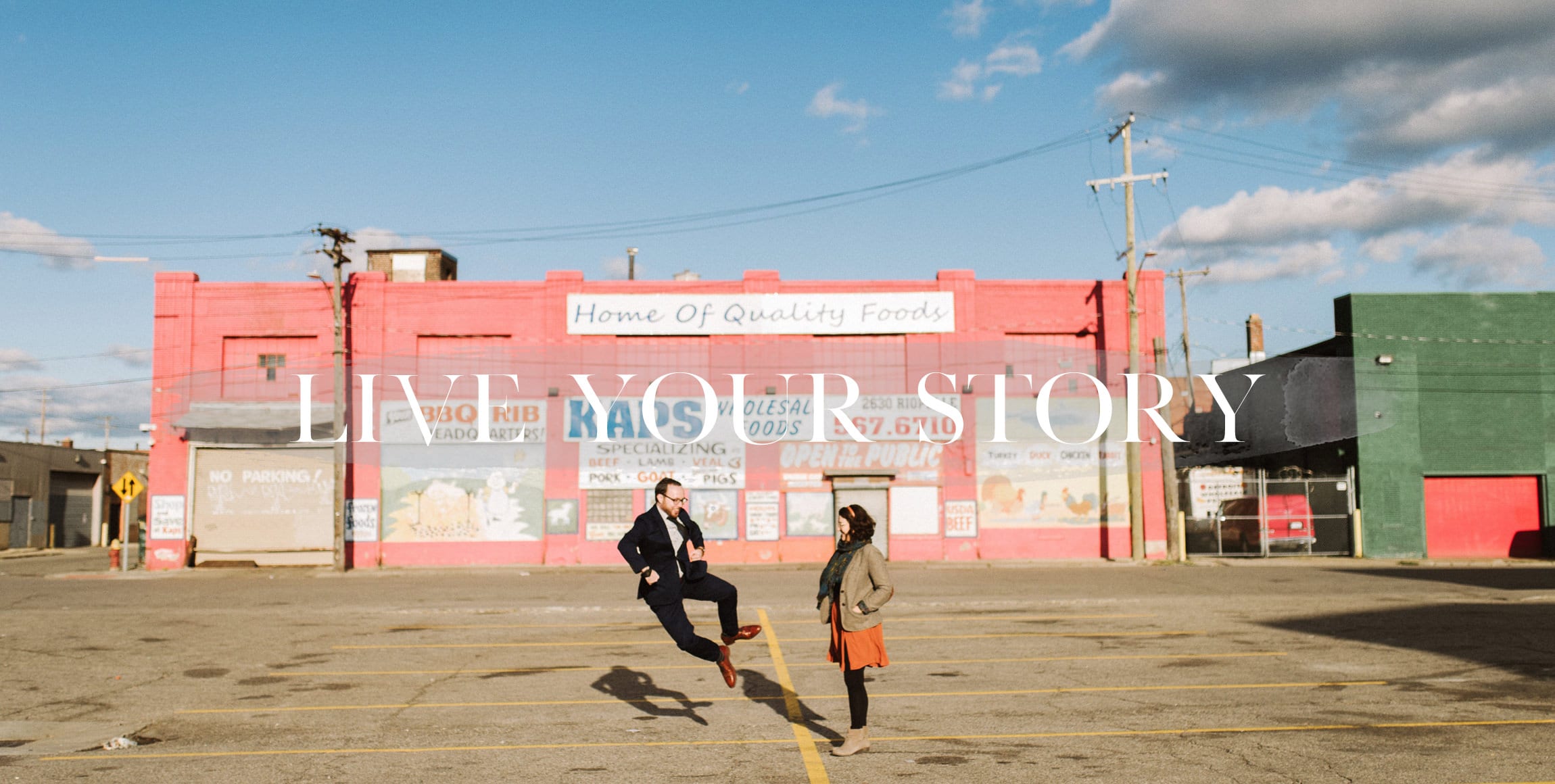 a fun couple poses for their engagement photography in eastern market detroit