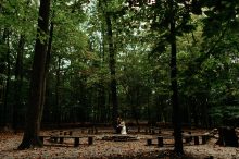 bride and groom at the fire circle at prince william forest park