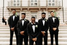 groom with his groomsmen in tuxedos