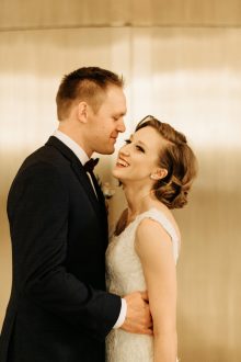 bride and groom in the fisher building by candid Detroit wedding photographer Heather Jowett