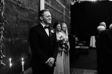 groom watching his bride come down the aisle