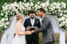 a ring exchange during a backyard wedding