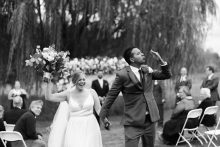 a groom blows a kiss after his wedding ceremony