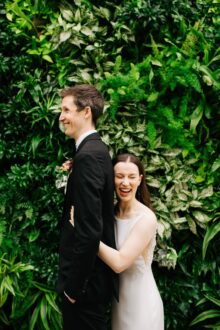 bride and groom laughing in a portrait from their Planterra Conservatory Wedding 1