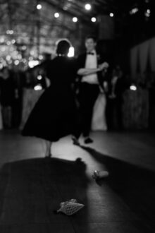 the mother of the grooms shoes after she kicked them off to better dance