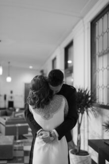 Black and white photo of the couple embracing after the first look by Detoit Wedding Photographer Heather Jowett
