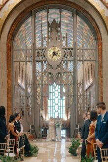 bride walks down the aisle with her mother during her Guardian Building Wedding