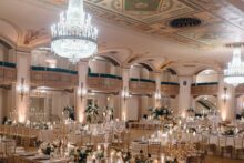 Wide shot of the reception setup in the Crystal Ballroom at the Detroit Masonic Temple designed by simply brilliant events