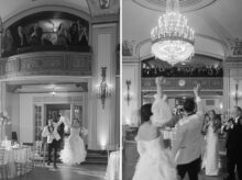 Black and white image of bride and groom making a joyful grand entrance into the Masonic Temple Crystal Ballroom as guests cheer from the mezzanine level